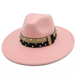 Detail of pink wide brim fedora hat featuring pearl and rhinestone embellished band