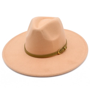 Detail of peach pink wool fedora hat with green leather band and gold buckle