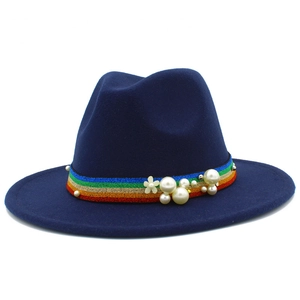 Detail of navy wool fedora hat featuring rainbow ribbon with pearls and flower accents