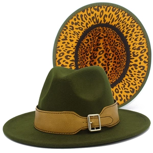 Detail view of army green fedora with leopard print lining and faux leather strap
