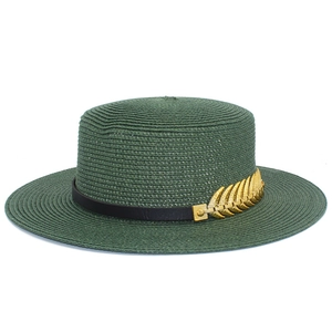 Detailed close-up of dark green boater hat with black leather band and gold leaf accent