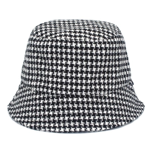 Classic black and white houndstooth bucket hat in retro style for women