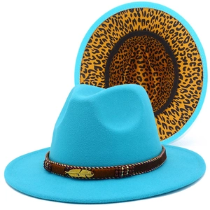 Close-up of turquoise wool fedora with leopard print lining and golden feather accent