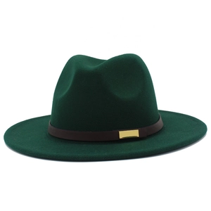 Detail of dark green fedora hat featuring brown leather band and gold metal buckle