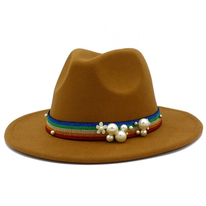 Detail of a brown wool fedora hat featuring a colorful striped band and white faux pearls