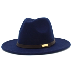 Detailed view of navy blue wool fedora with brown leather band and gold buckle