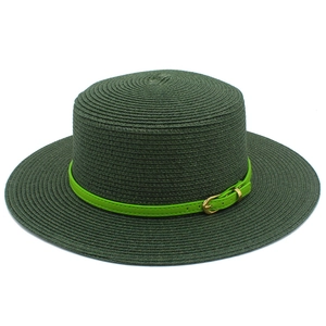 Detail of dark green straw boater hat with bright green belt and gold buckle decoration
