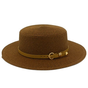 Detailed weave of dark brown straw sun hat with leather band and golden heart rivet buckle