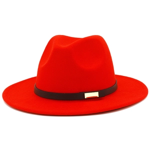 Detail of red wool fedora hat featuring a thin black leather belt with gold metal buckle