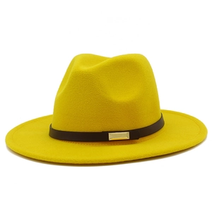 Close-up of a yellow wool felt fedora hat featuring a black leather band and gold buckle