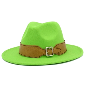 Detail of bright green wool fedora hat featuring a brown leather band and silver buckle