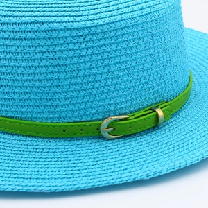 Light blue straw sun hat featuring a bright green leather belt and gold buckle detail