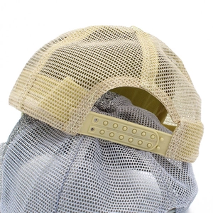 Detail view of breathable mesh trucker hat with adjustable plastic snapback closure