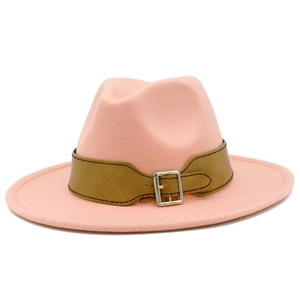 Detail of light pink fedora hat with a brown faux leather belt and silver metal buckle
