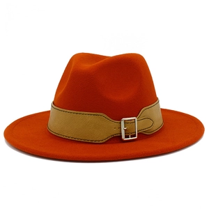 Orange felt fedora hat with wide brim and leather strap with silver buckle for men and women