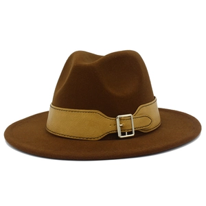 Detail of dark brown wool fedora with khaki leather band and silver metal buckle