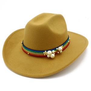 Detail of khaki wool fedora hat with rainbow braided band, pearls and gold floral decor