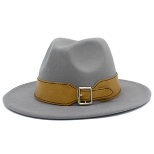 Macro shot of light gray wool felt fedora featuring a ginger yellow faux leather belt