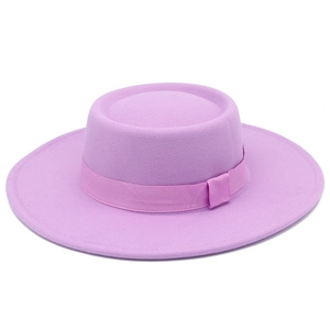 Close-up of a lavender wool boater hat featuring a flat top and matching grosgrain ribbon