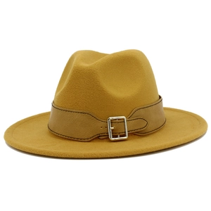 Detail of ginger wool fedora hat with khaki leather strap and silver buckle accent