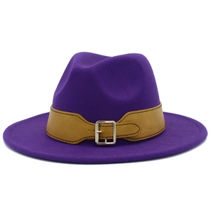 Detail of dark purple wool fedora hat with brown leather band and silver metal buckle