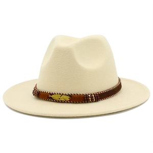 Close-up of beige wool fedora featuring a bohemian band with beads and metal feather