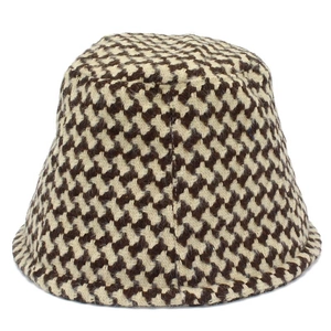 Classic houndstooth bucket hat in brown and cream tweed fabric for autumn winter fashion