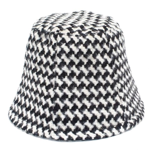 Classic black and white houndstooth bucket hat with vintage woven texture design