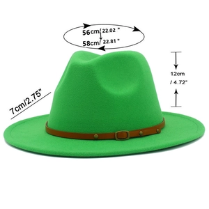 Close-up of bright green wool felt fedora hat with brown leather belt and metallic buckle