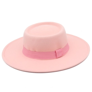 Detailed top view of pink flat top wool felt hat featuring a decorative grosgrain ribbon