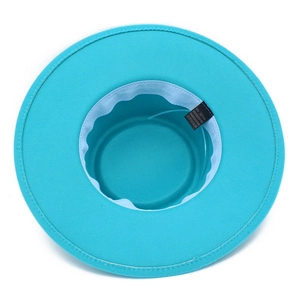 Detail view of the inner lining and label of a turquoise wide brim wool felt jazz hat
