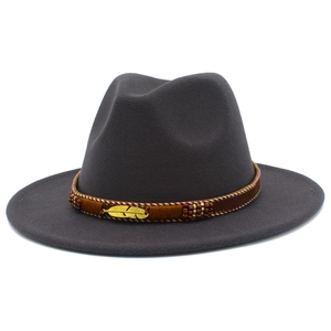 Detail of dark grey wool fedora featuring a golden feather metal buckle and woven band