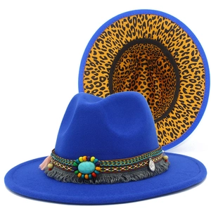Detail of blue wool fedora featuring turquoise beads, fringe and leopard print lining