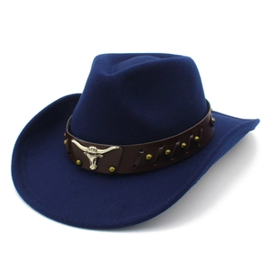 Detail of navy felt cowboy hat with leather band, gold studs, and silver bull skull buckle