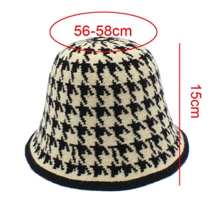 Detail view of houndstooth knit bucket hat with 56-58cm head size and 15cm height dimensions