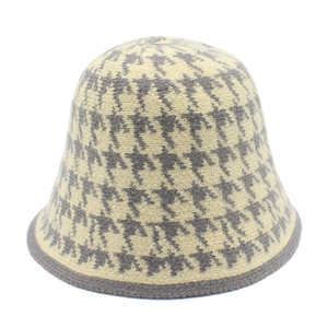 Close-up of the grey and beige houndstooth pattern texture on this knitted bucket hat