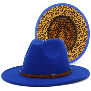 Close-up of royal blue fedora hat with leopard print lining and brown leather belt trim