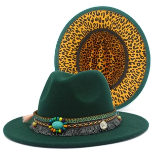 Detail of dark green felt fedora with ethnic band, turquoise bead and leopard print brim