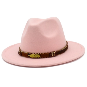 Close-up of light pink wool fedora hat featuring a brown woven band and gold feather detail