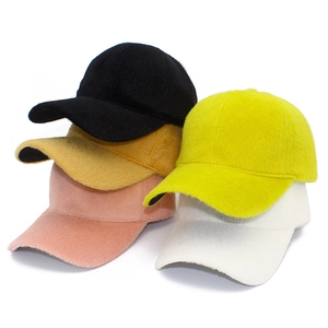 Detail of solid color faux mink fur baseball caps in five vibrant fluffy textured colors