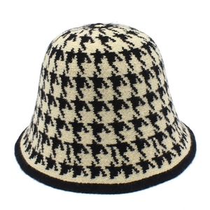Detail shot of black and white houndstooth knit bucket hat with premium crochet texture