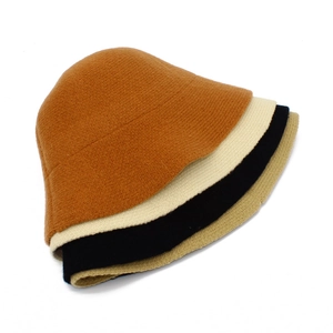 Knit wool bucket hats in four colors: caramel, cream, black, and khaki for autumn