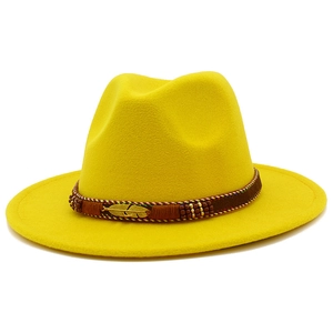 Detail of yellow wool fedora hat with gold feather buckle and bohemian beaded band