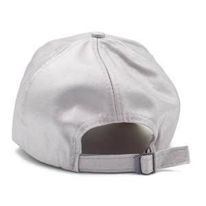 Detail view of silver satin baseball cap with adjustable metal buckle and smooth fabric