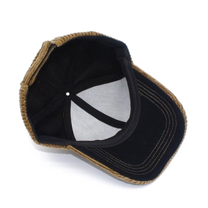 Detail view of corduroy baseball cap interior featuring sweatband and stitching