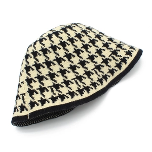 Classic black and white houndstooth knit bucket hat for women with black trim detail