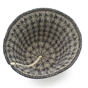 Close-up of houndstooth knit bucket hat showing premium weaving texture and drawstring