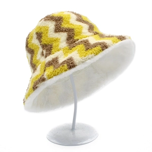 Detail of reversible striped plush bucket hat with warm faux fur lining for winter