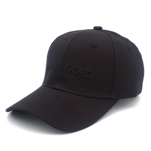 Classic black cotton baseball cap with UNPLUGGED 3D embroidery on a white background