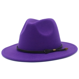 Detail view of purple wool fedora hat with a black braided band and gold arrow buckle
